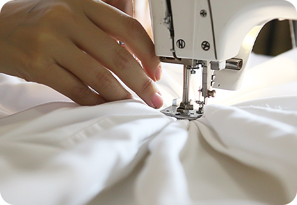 High-quality Devon Duvets handcrafted by skilled seamstresses, each product signed off individually for guaranteed excellence in sleep comfort."