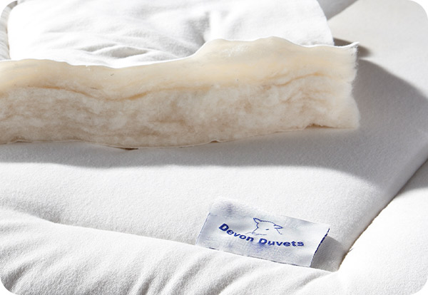 Award-winning Devon Duvets, celebrated for superior quality and innovation in bedding, featuring our Indie Best Buy 2023 lightweight British wool duvet.