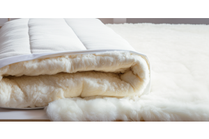 Close-up view of Devon Duvets' plush wool-filled mattress topper.