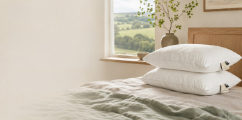 two pillows stacked on one another in a bedroom.