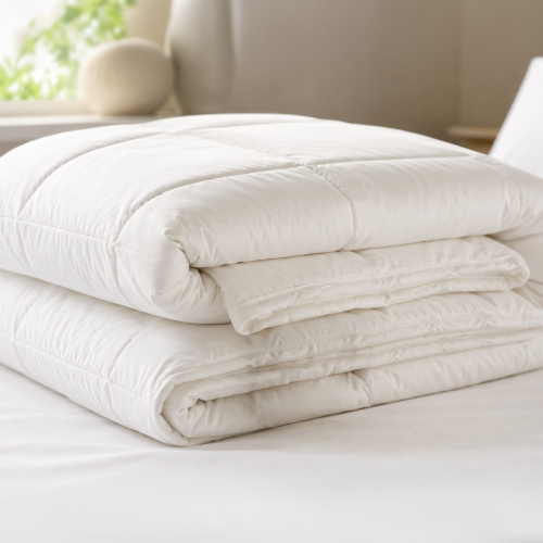 Clearance Botanic Medium Weight box-stitched duvet folded on a white bed