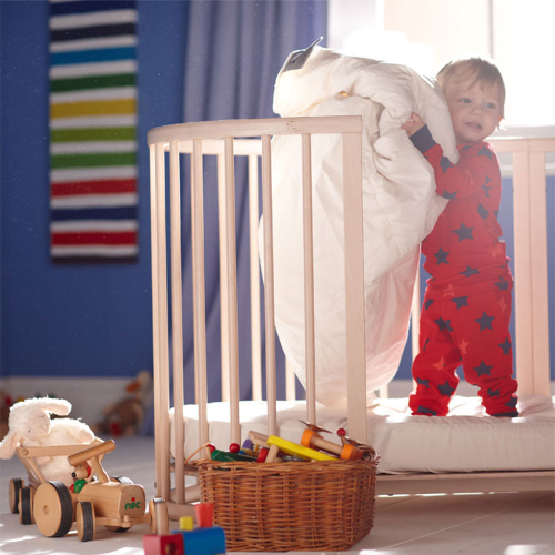 Natural wool children's duvet with soft cotton cover rolled for display