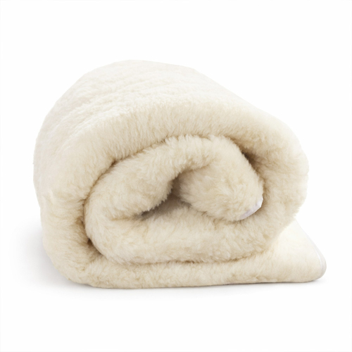rolled wool fleece mattress topper close-up on white background