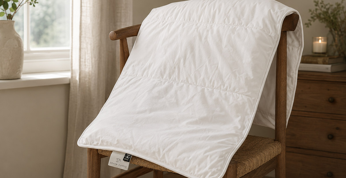 Wool pillow airing naturally beside an open window in a calm bedroom.