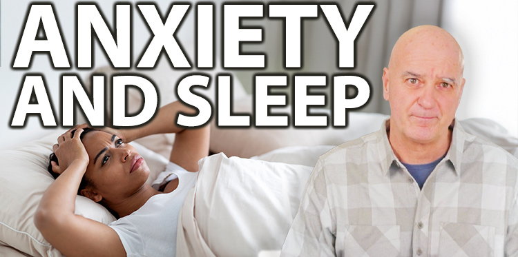A man struggling to sleep because of anxiety.