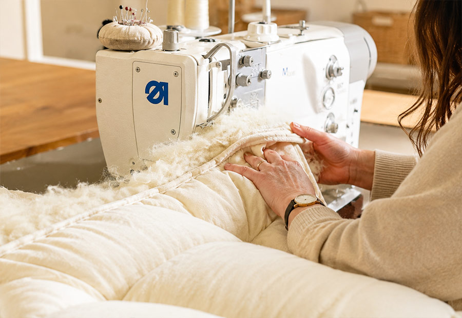 Close-up of a handcrafted Devon Duvets British wool mattress topper