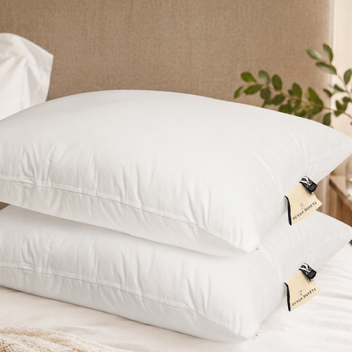 Close-up of two Devon Duvets wool pillows with branded labels