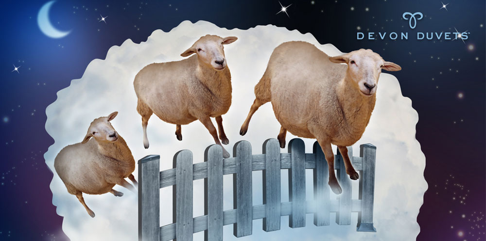 Sheep jumping over a fence to represent sleep under Devon Duvets UK bedding.