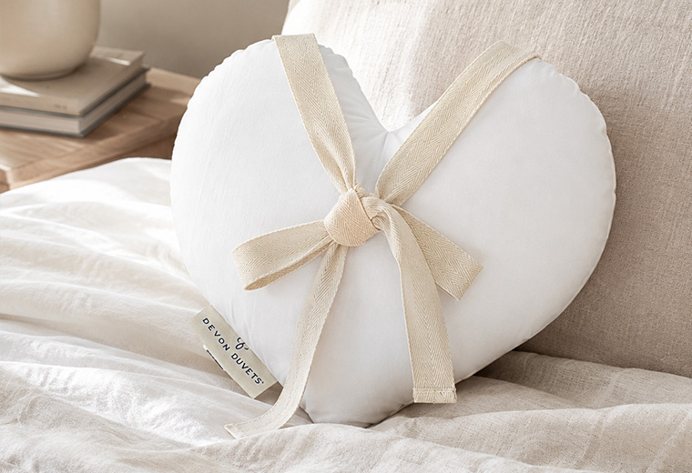 Heart Shaped Comfort Cushion being gently reshaped after washing.