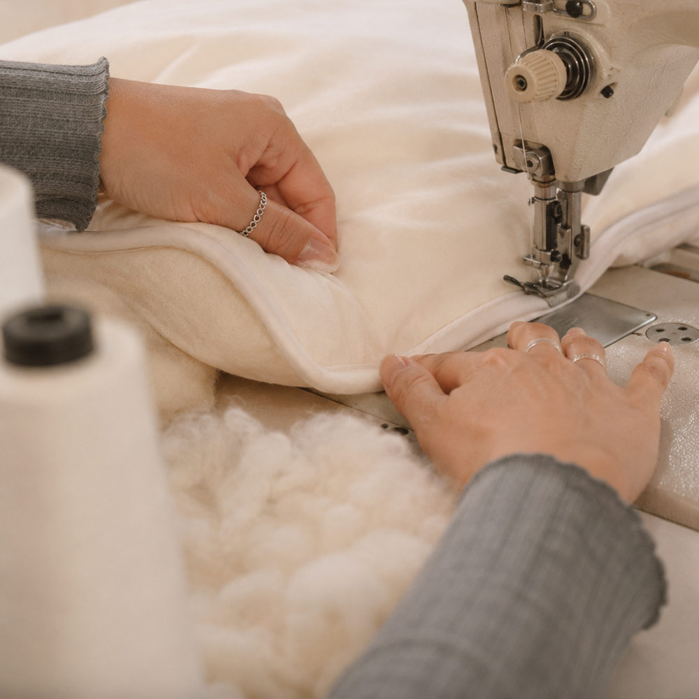 Close-up of natural British wool fibres showing their soft crimped structure.