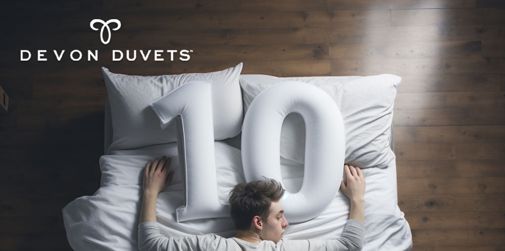 A person peacefully sleeping on a symbolic 'number 10', representing ten insightful facts about sleep and the impact of quality bedding.