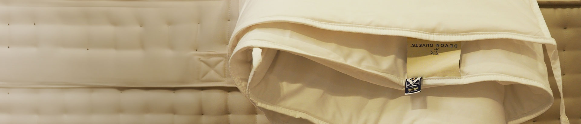 Devon Duvet with detailed close-up of natural wool fibers used in Devon Duvets’ hypoallergenic and eco-friendly products.