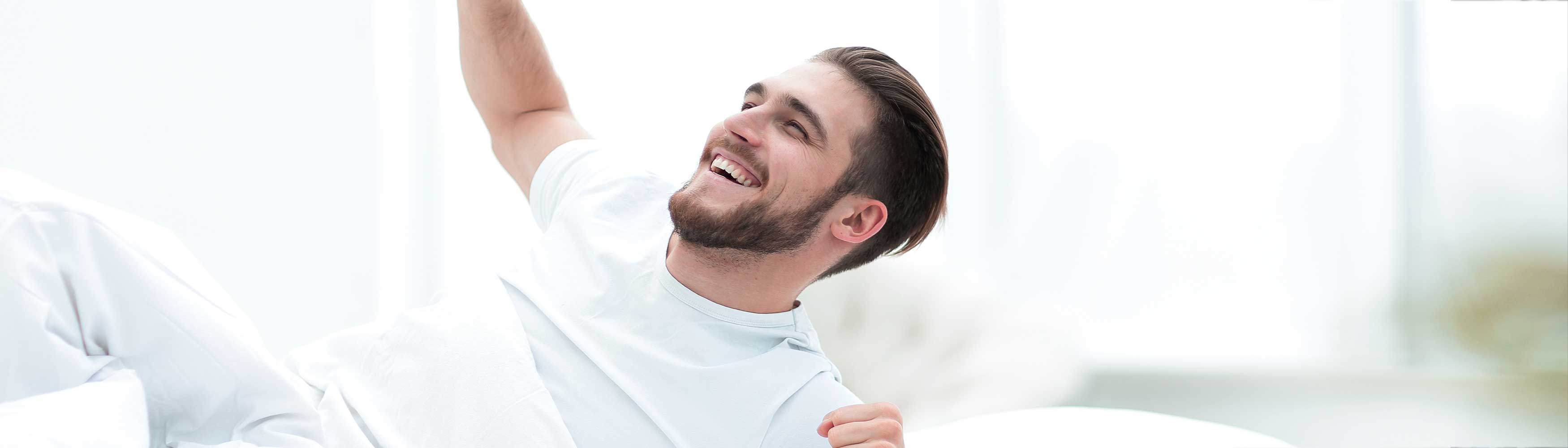 Man enjoying a deep, restful sleep with a Devon Duvets product on World Sleep Day