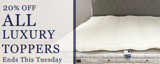 luxurious mattress topper on a bed with offer code.