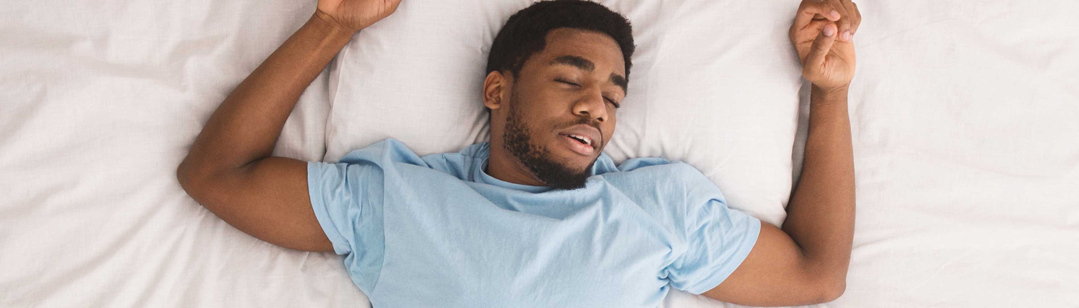 Man enjoying a relaxing moment in bed