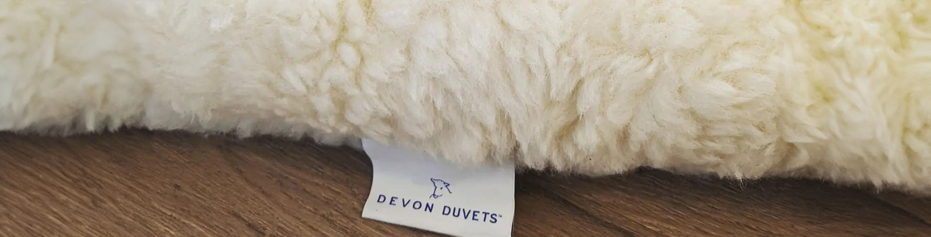 Signature Devon Duvets label, symbolising handcrafted quality and authenticity.